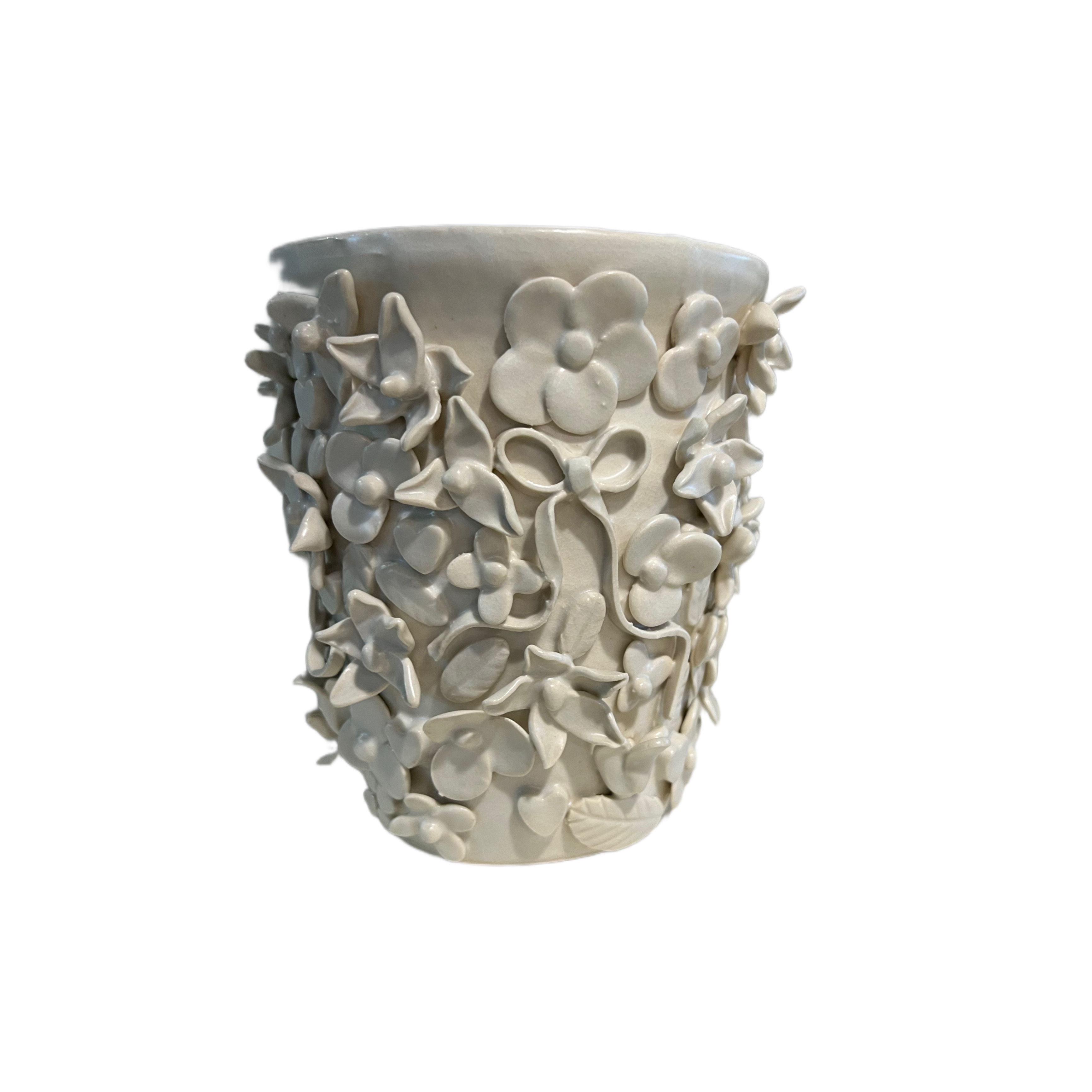 White porcelain vessel covered in dimensional handbuilt flowers