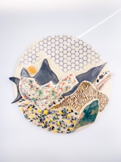 Tall ceramic wall piece with landscape pattern