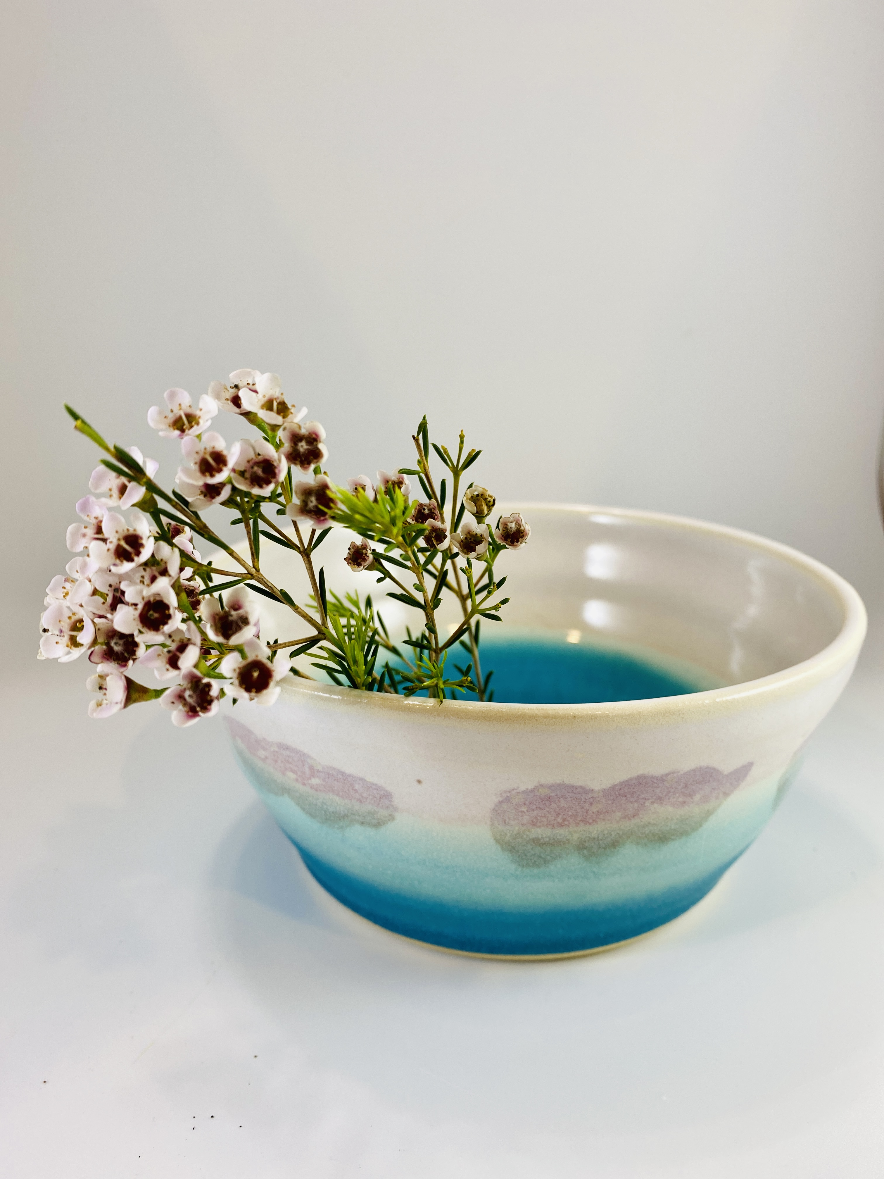 Dark sgraffito bowls with carved handwritten text