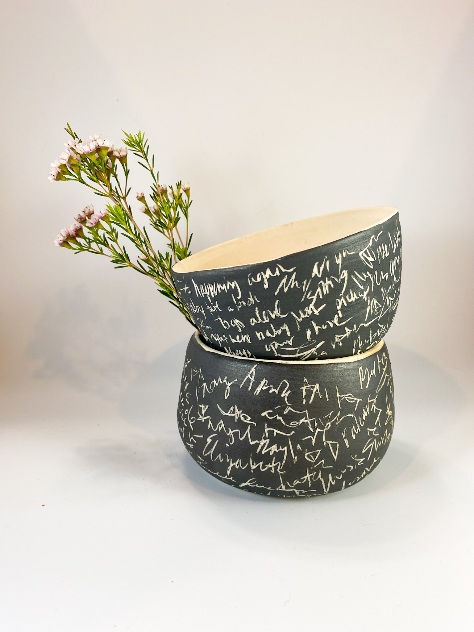 Ceramic bowl with teal glaze and cloud motifs